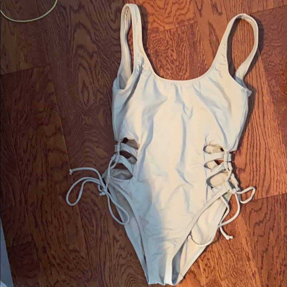 Never worn tie-up one piece bathing suit